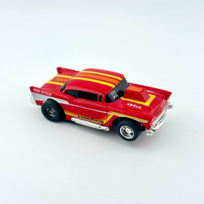 Red and yellow toy car on a white background