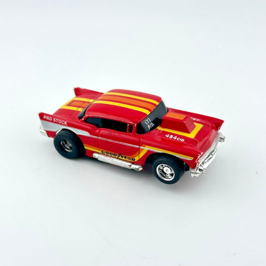 Red and yellow toy car on a white background