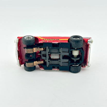 Close-up of underside of slot car on a white background