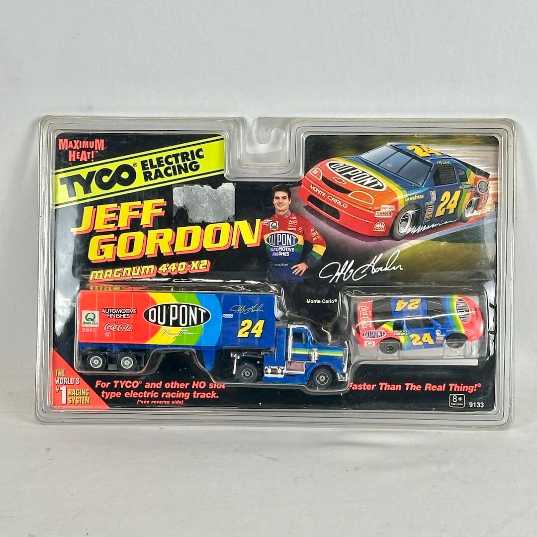 Packaged toy cars with Jeff Gordon branding on a gray background