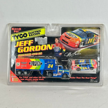 Packaged toy cars with Jeff Gordon branding on a gray background