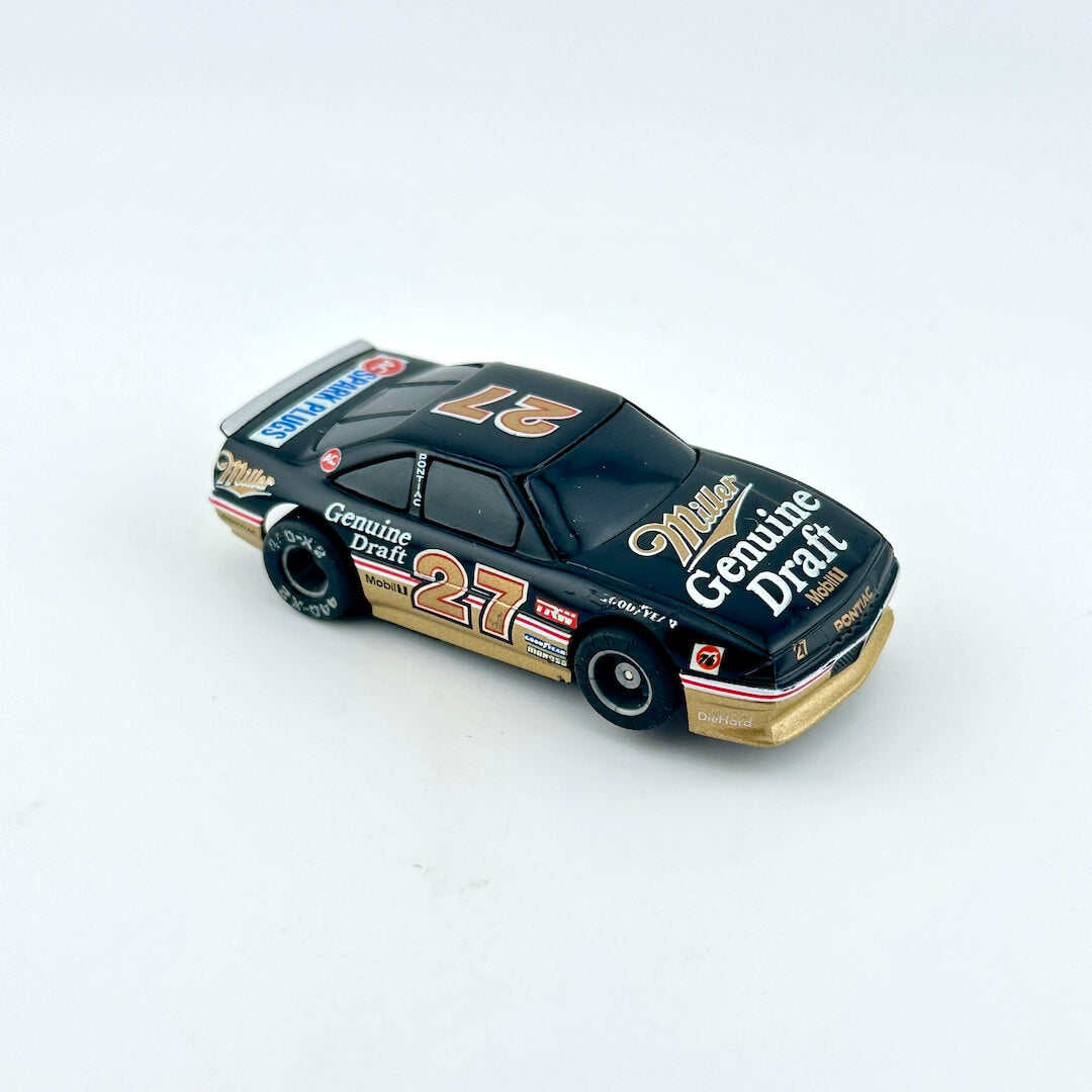 Model race car with 'Genuine Draft' branding on a white background