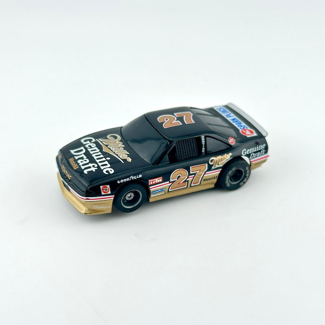 Model race car with number 27 on a white background