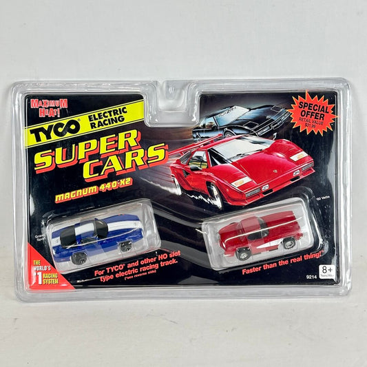 Tyco Super Cars packaging with two toy cars on a gray background