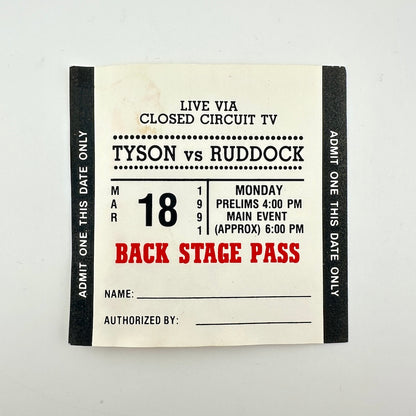 A vintage-style backstage pass ticket with black side borders, an off-white center, and red text reading 'BACKSTAGE PASS.' 