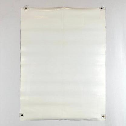 Backside of poster showing wave to poster from being rolled.