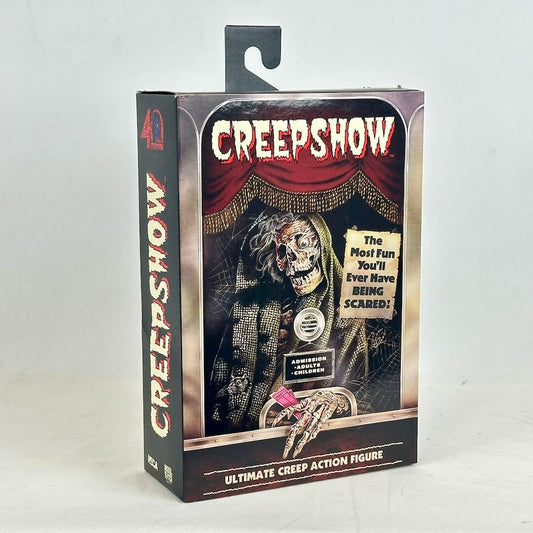Creepshow action figure packaging with a skeleton in a suit and red curtain background.