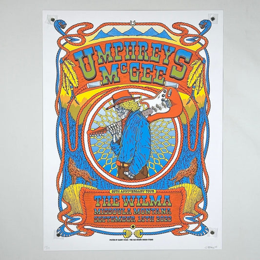 Colorful poster for Umphrey's McGee concert at The Wilma, featuring a person playing guitar.