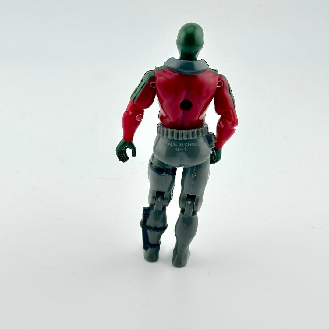 Toy figure with red and gray suit on a white background