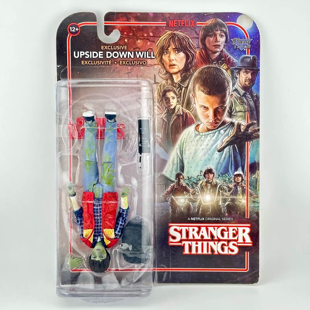 Stranger Things action figure in original blister packaging, photographed on white background.