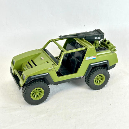 A vintage GI Joe vehicle resembling a jeep with gun turret on back, displayed against white background.