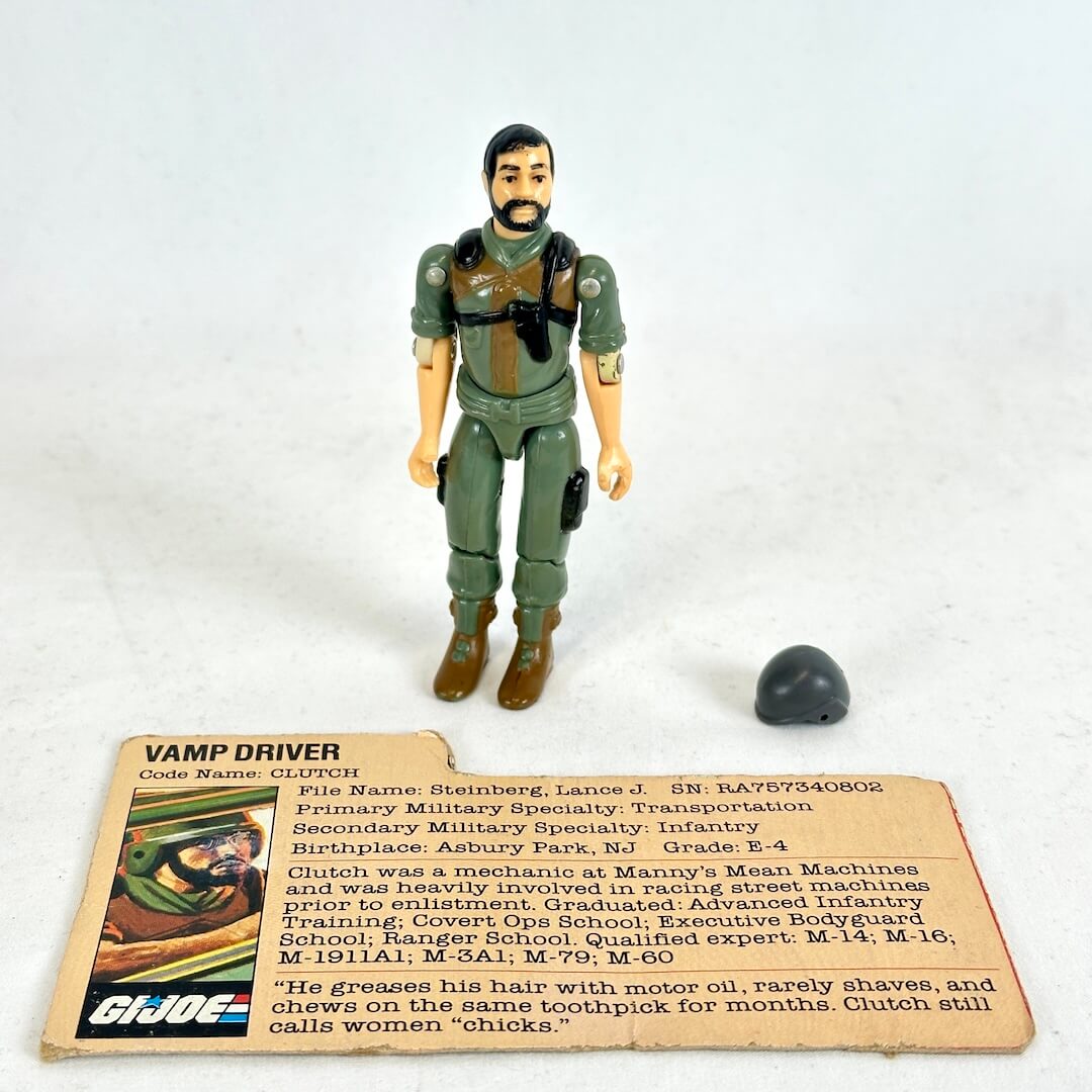 A vintage GI Joe action figure stands upright next to a helmet, and its original printed card on a white background.
