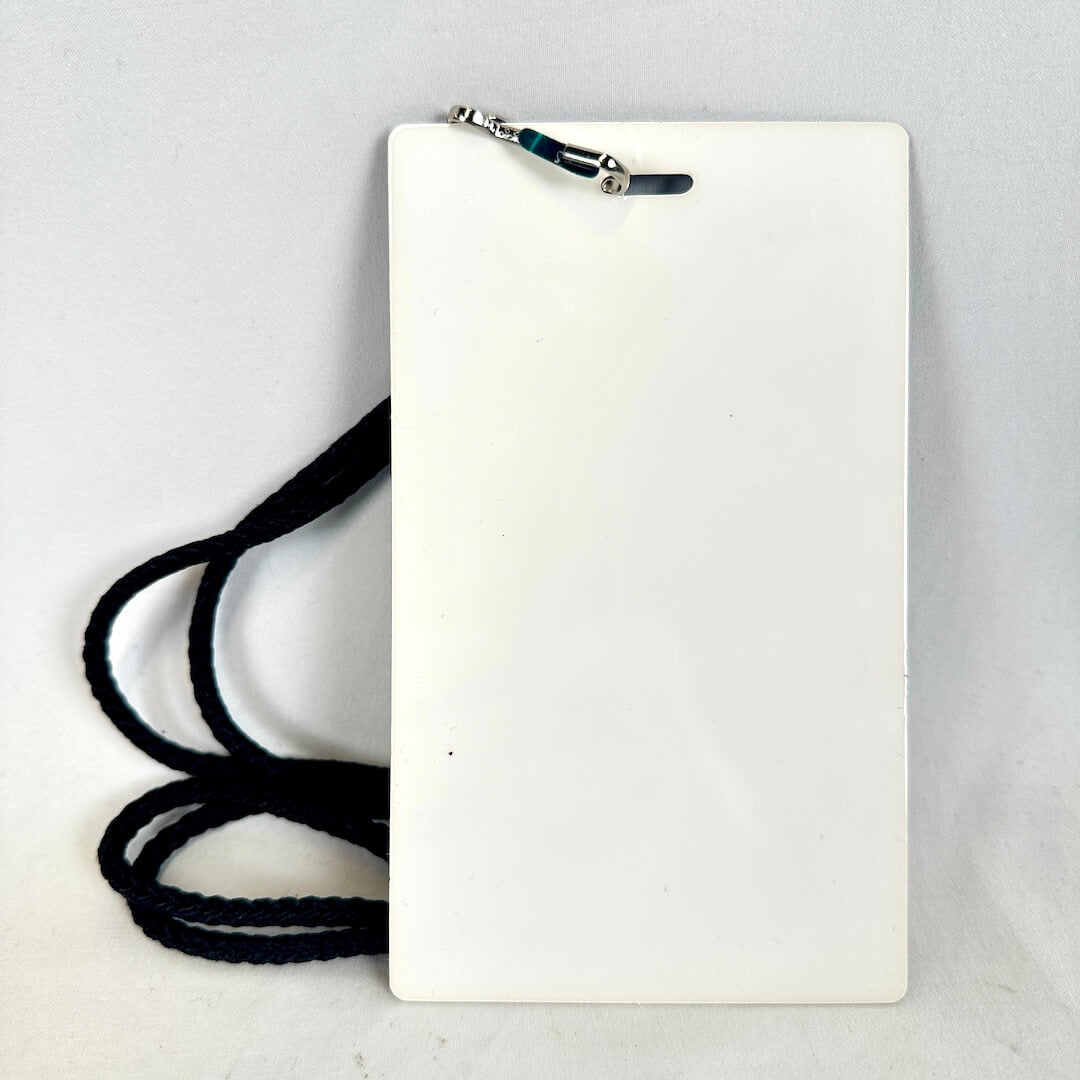 White rectangular card with a black lanyard on a light gray background