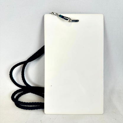 White rectangular card with a black lanyard on a light gray background