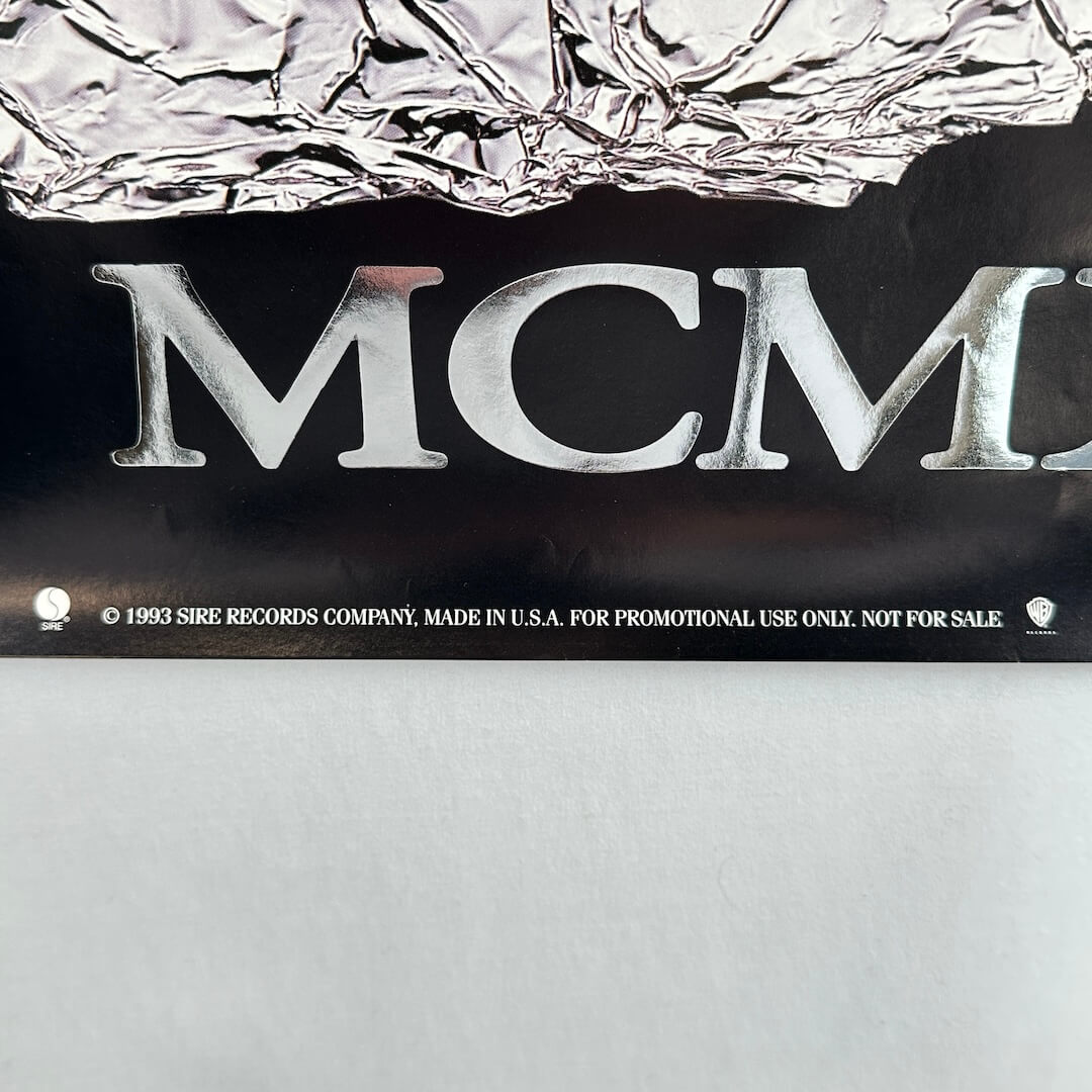 Close up of promo poster information at bottom in white text