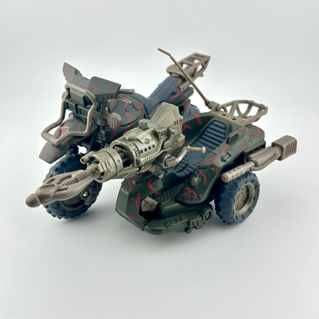 Toy vehicle with a gun on a white background