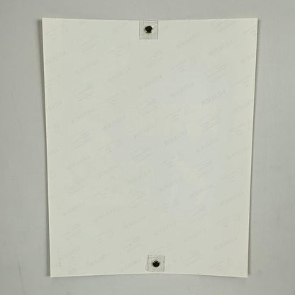 Backside of photo with watermarks for photo paper company on light background. 