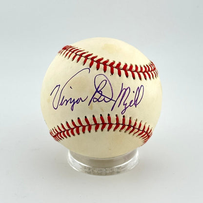 Baseball with autograph on a clear stand against a light gray background