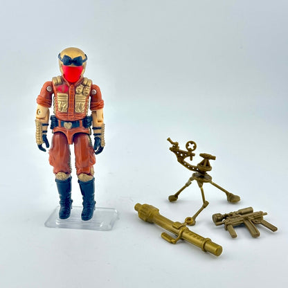 Action figure with a helmet and goggles, accompanied by two small golden mechanical figures on a white background.