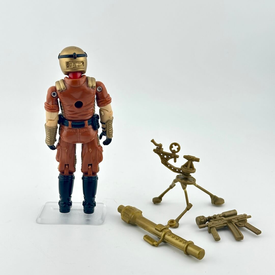 Action figure in brown and blue outfit with accessories on a white background