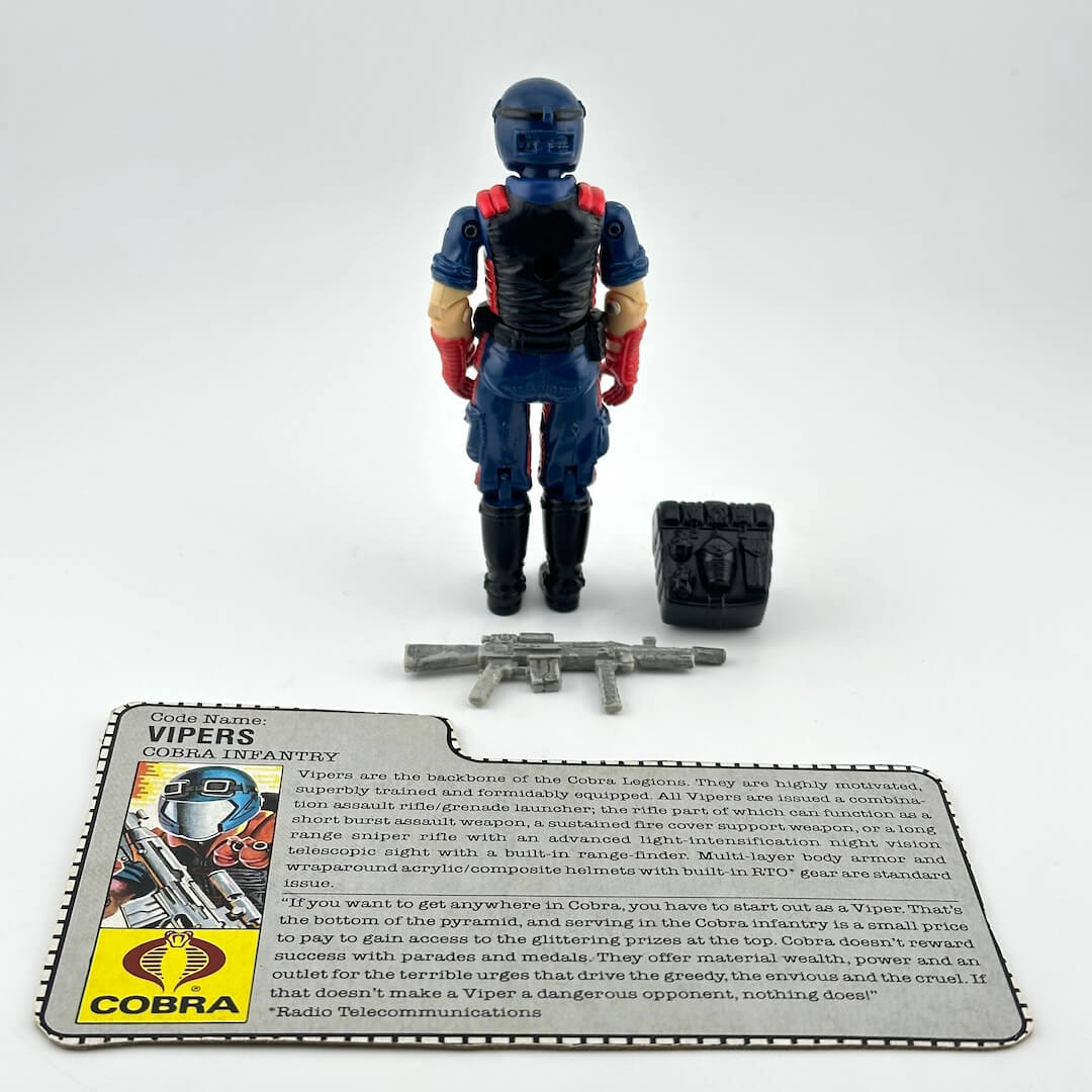 A Cobra action figure of Vipers, a blue and red toy soldier with black legs, standing next to its accessories.