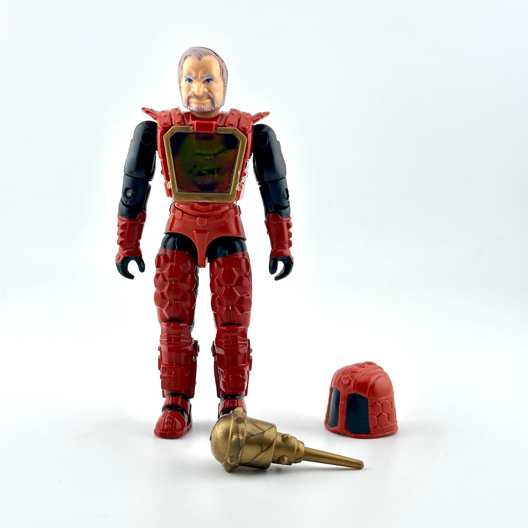 Action figure in black and red armor with two accessories on white background. 