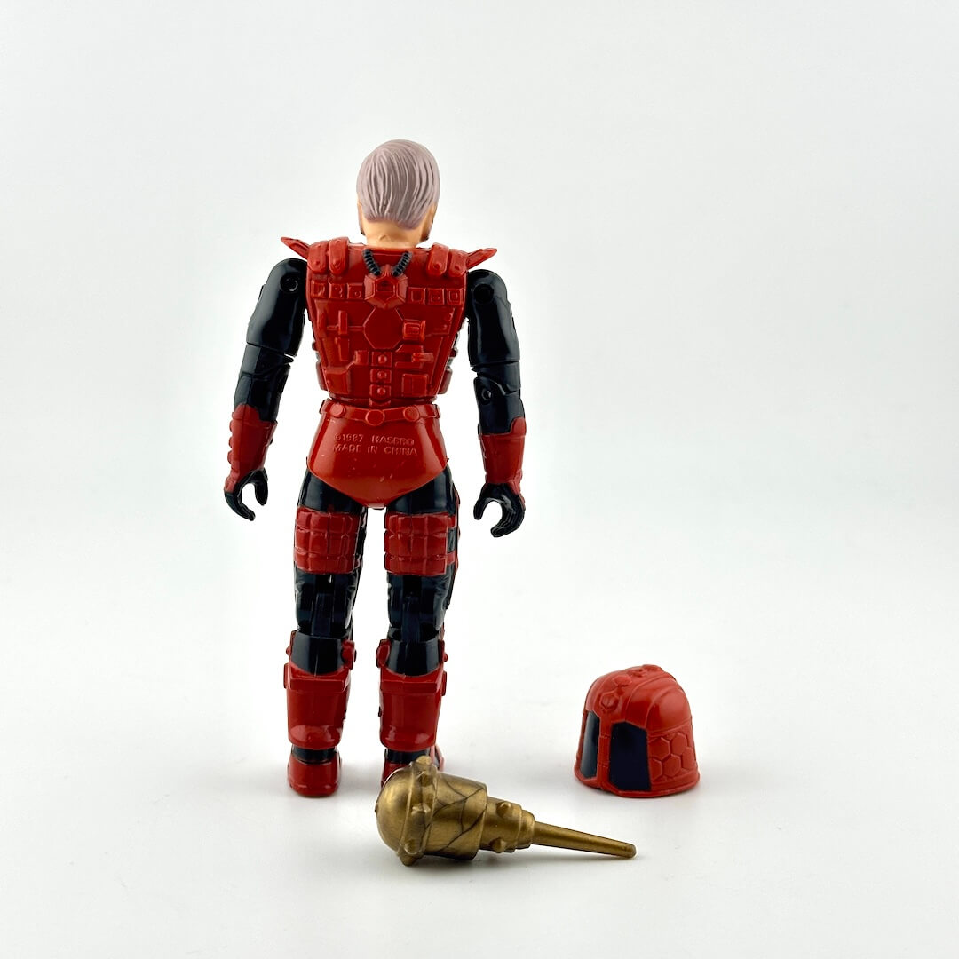 Action figure in black and red armor with two accessories on white background. 