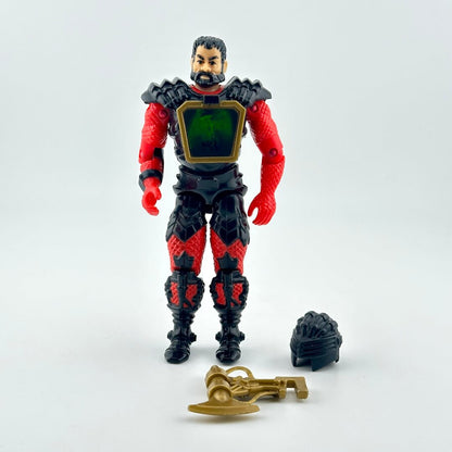 A red and black armored action figure with a green chest panel, shown with two accessories on white background. 