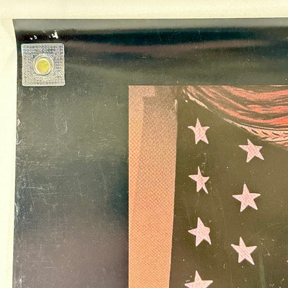 Top left corner of poster with pin holes and light scratches to face. 