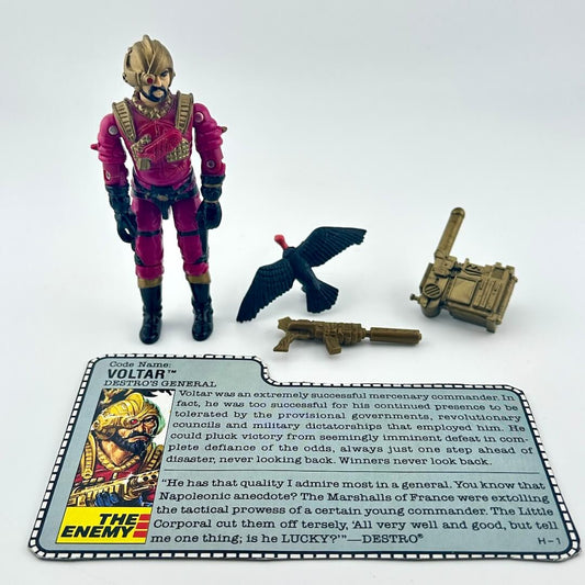 G.I. Joe action figure with accessories and character card against white background.