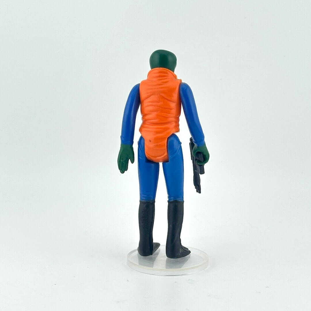 Action figure with green skin, blue suit, and orange vest on a white background