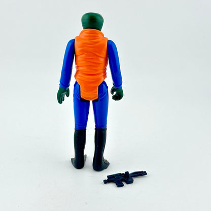 Action figure of alien in blue suit and orange shirt with weapon on white background.