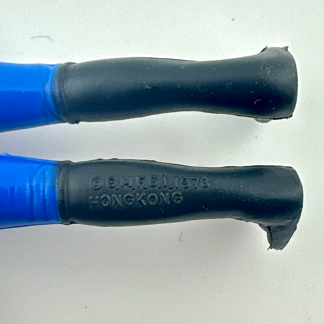 Close-up of back of figure's legs to show COO and copyright information. 
