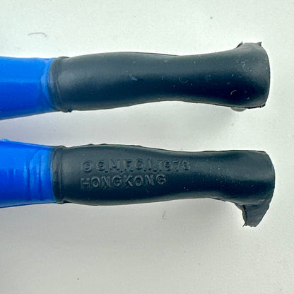 Close-up of back of figure's legs to show COO and copyright information. 