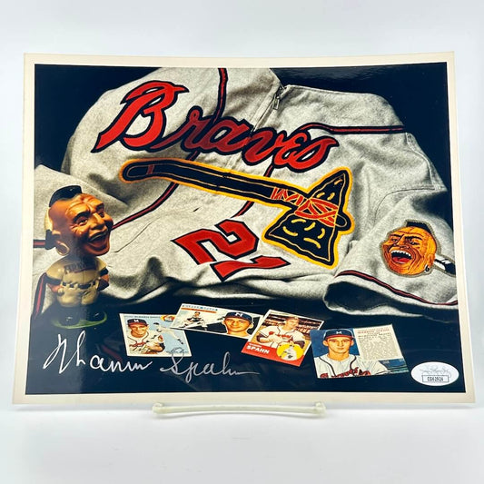 Photograph of memorabilia collage featuring signature of player, JSA authentication sticker in corner. 