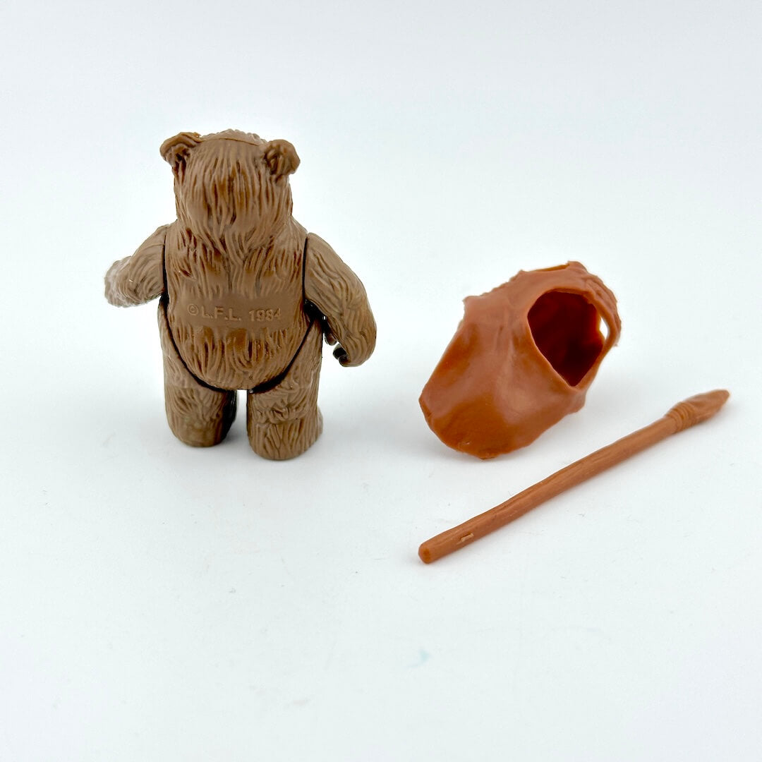 Ewok action figure with hood and spear on white background. 