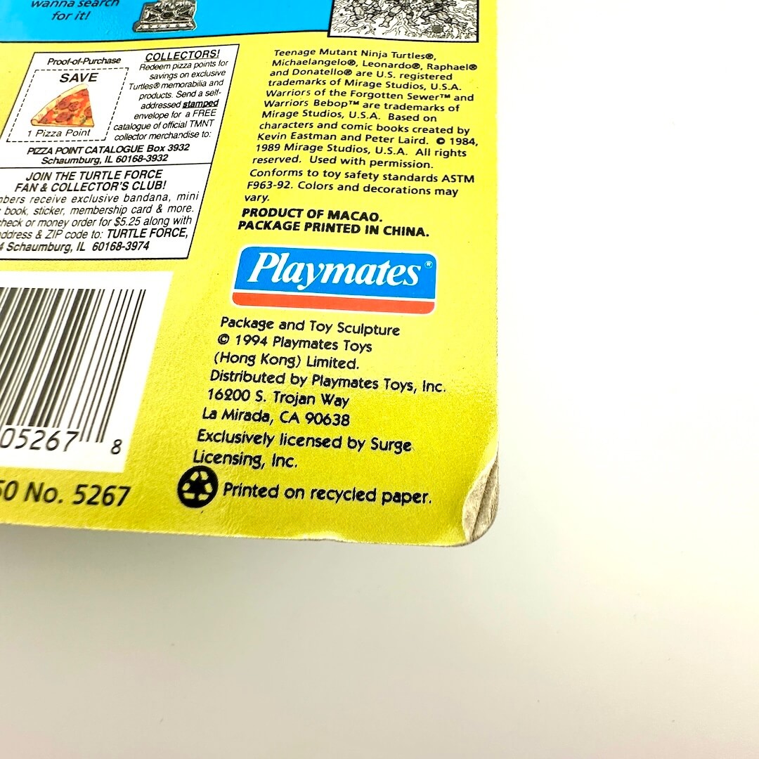 Back of a toy packaging with Playmates branding and product details.