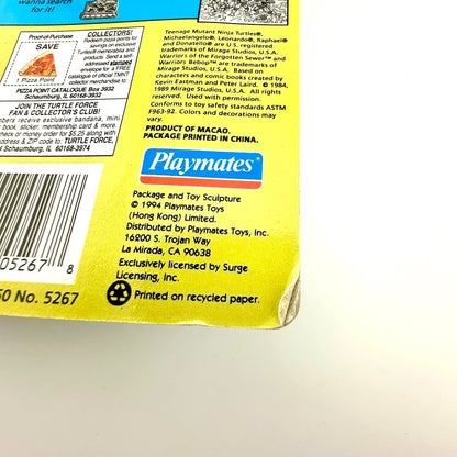 Back of a toy packaging with Playmates branding and product details.