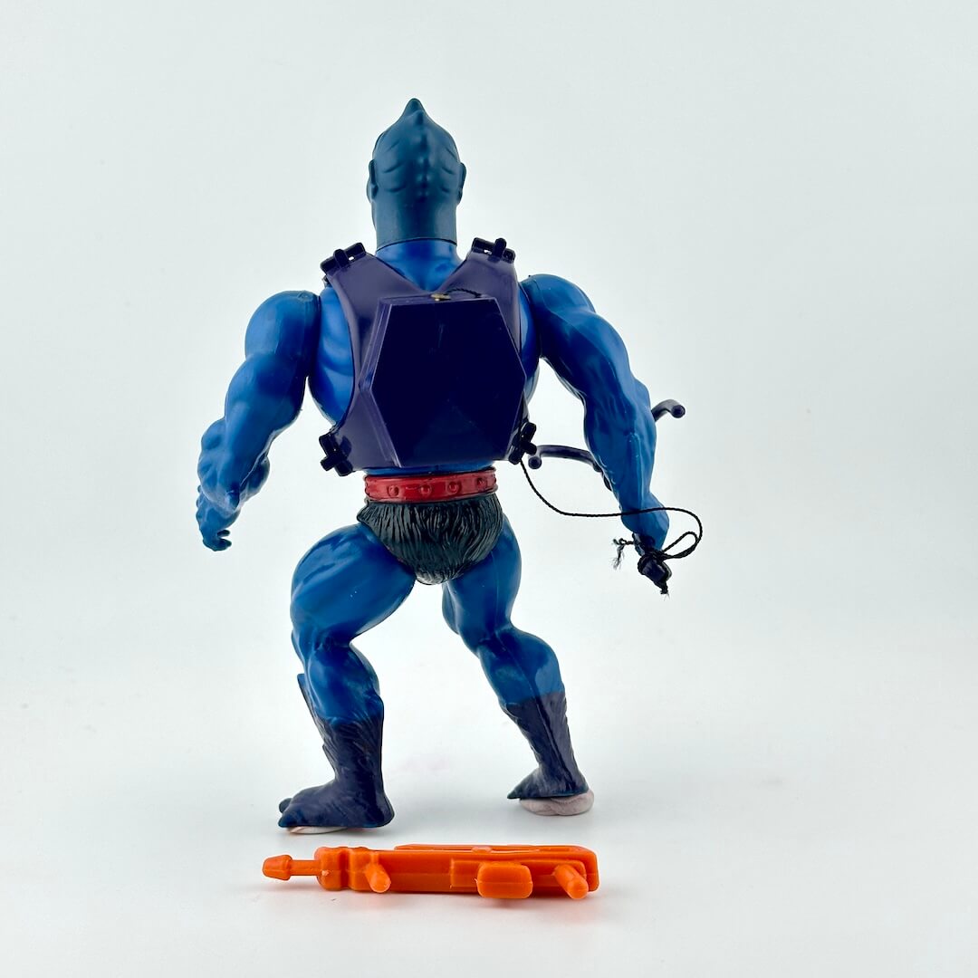 Toy figure with blue and purple costume, red accents, and orange weapon on a white background