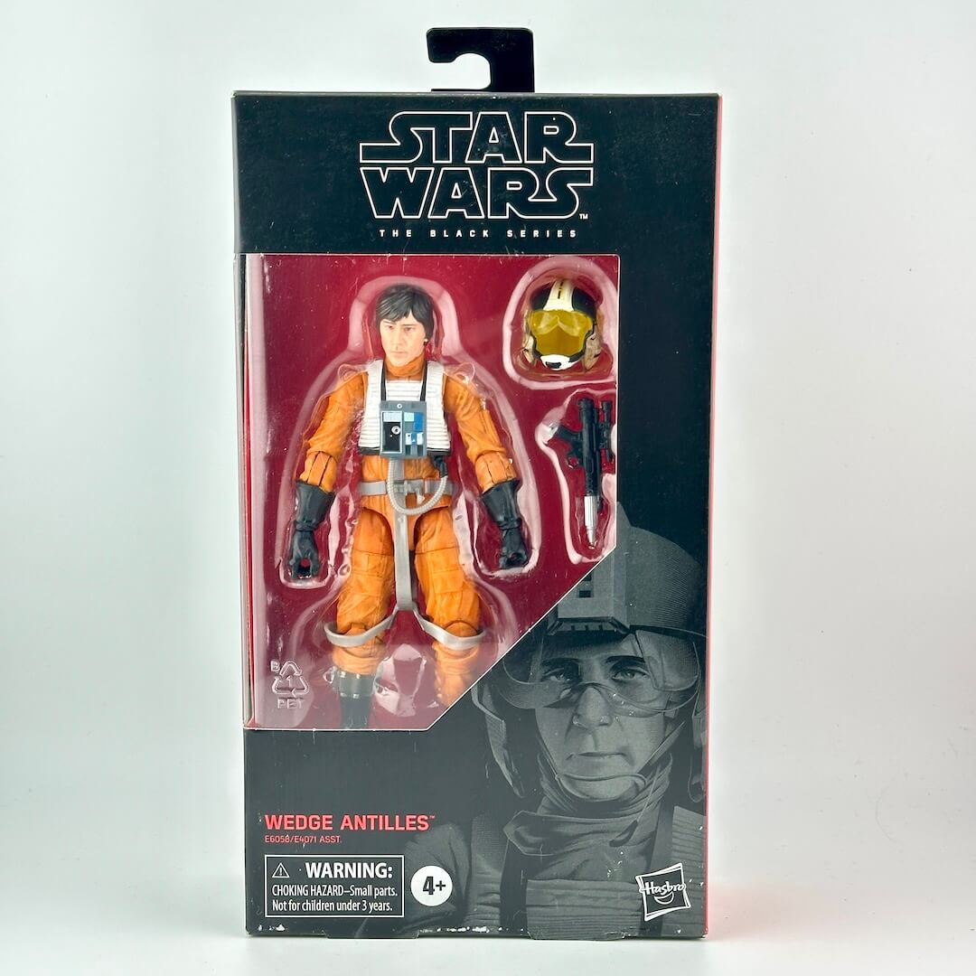Star Wars The Black Series Wedge Antilles action figure in its original black and red packaging, featuring a clear window.