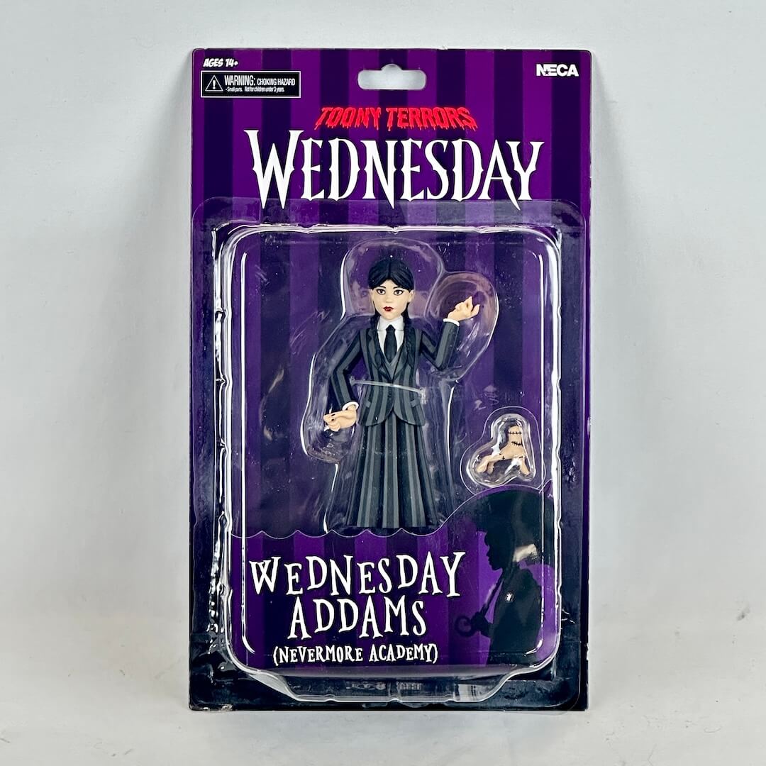 Action figure packaging of Wednesday Addams from the Addams Family series on a white background