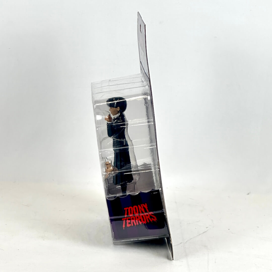 Toy figure in a transparent packaging with 'Toony Terrors' branding on a white background