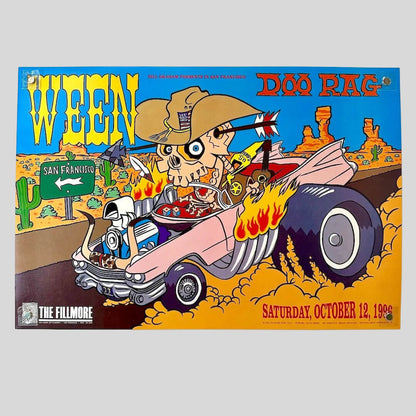 Colorful concert poster for Ween featuring a skeleton in a car with desert landscape background.