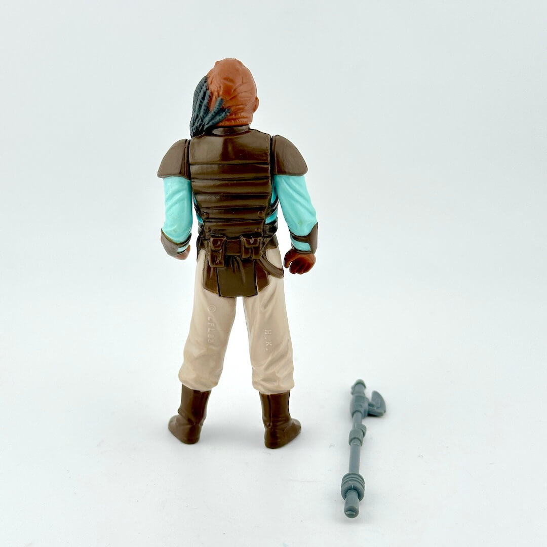 Action figure with a weapon on a white background