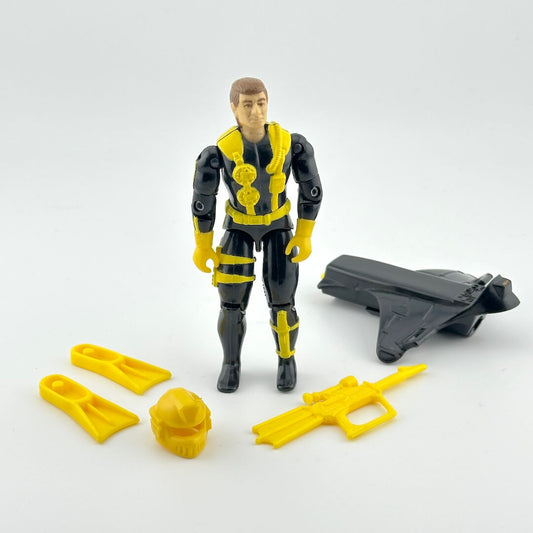 Toy figure in black and yellow outfit with accessories on a white background