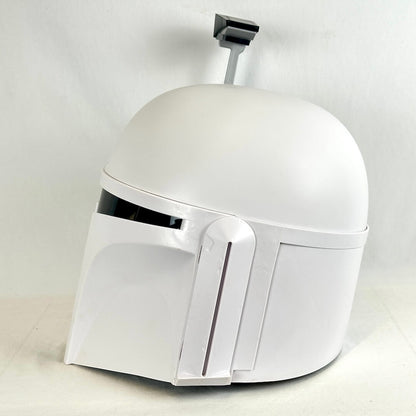 A white Mandalorian-style helmet replica with a black visor slit, photographed against a plain light background.