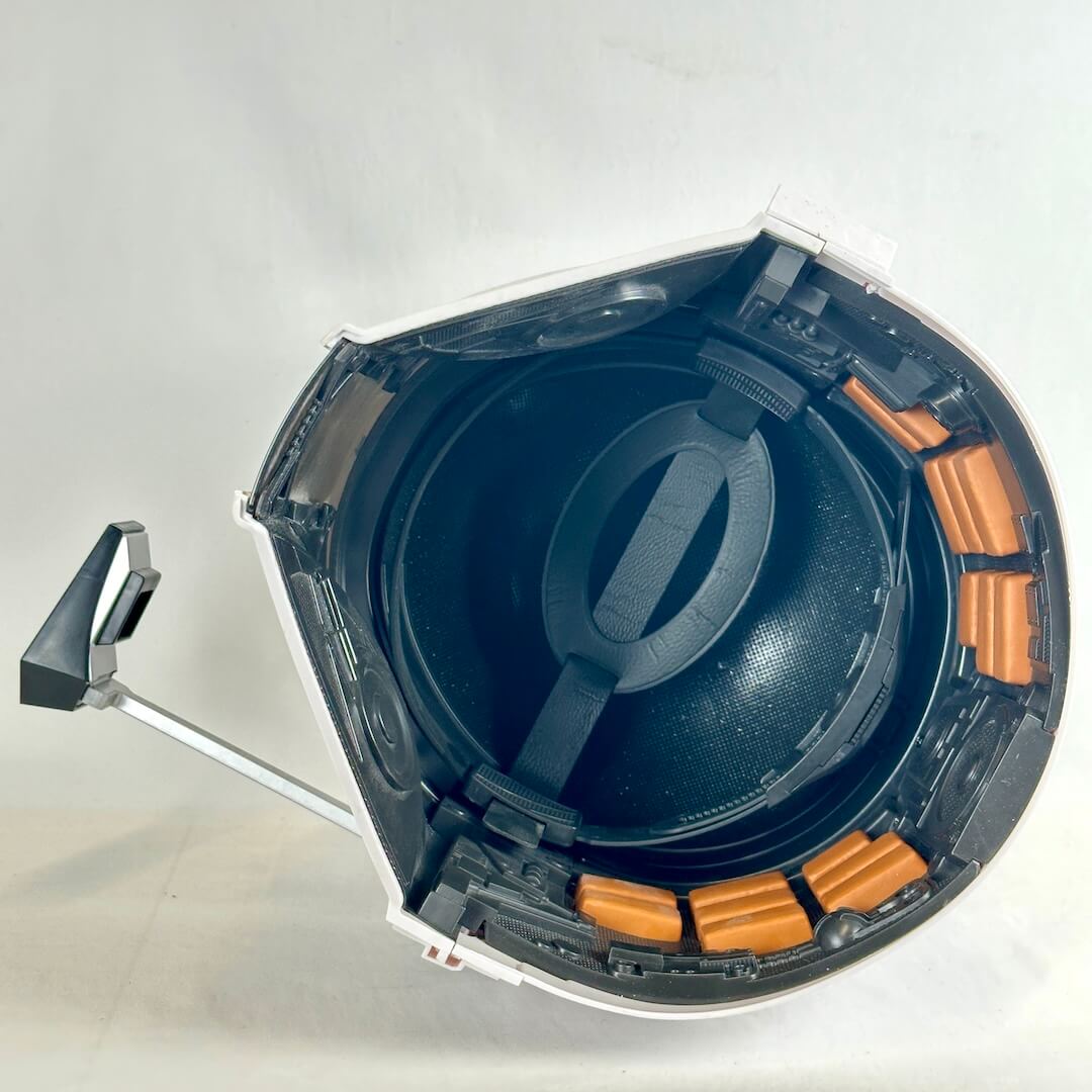Interior view of helmet showing adjustable strap and cushions and next to no wear. 