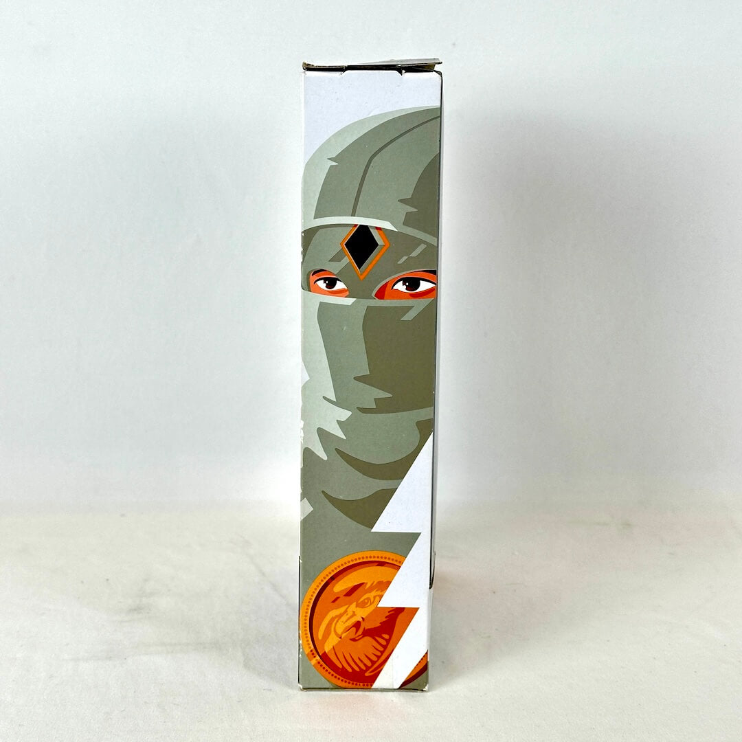 Side view of packaging with illustration of White Ranger, photographed against white background. 