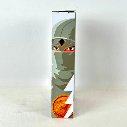 Side view of packaging with illustration of White Ranger, photographed against white background. 