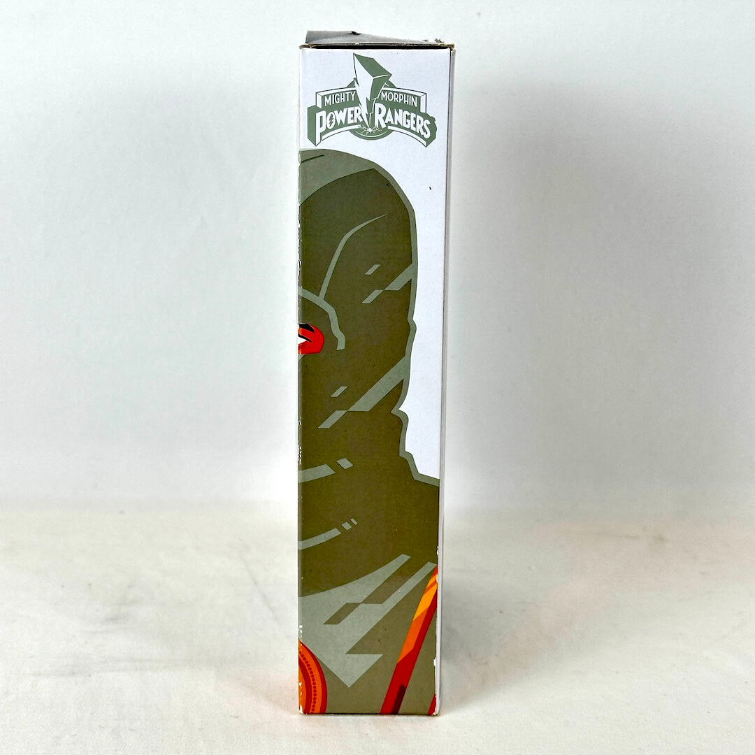 Side view of packaging with illustration of White Ranger under Power Rangers logo. 